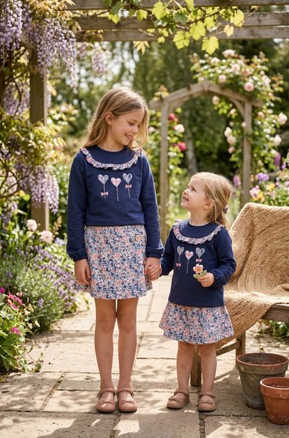 Conjunto Falda Floral y Sudadera Azul Marino Niña | Sonajero Kids